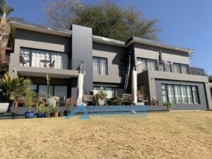 house wall after crack repair and waterproof paint application, showing a smooth and renewed surface.