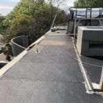 Flat roof at Parktown North showing Torch-On waterproofing already applied by TM Waterproofing before final completion.