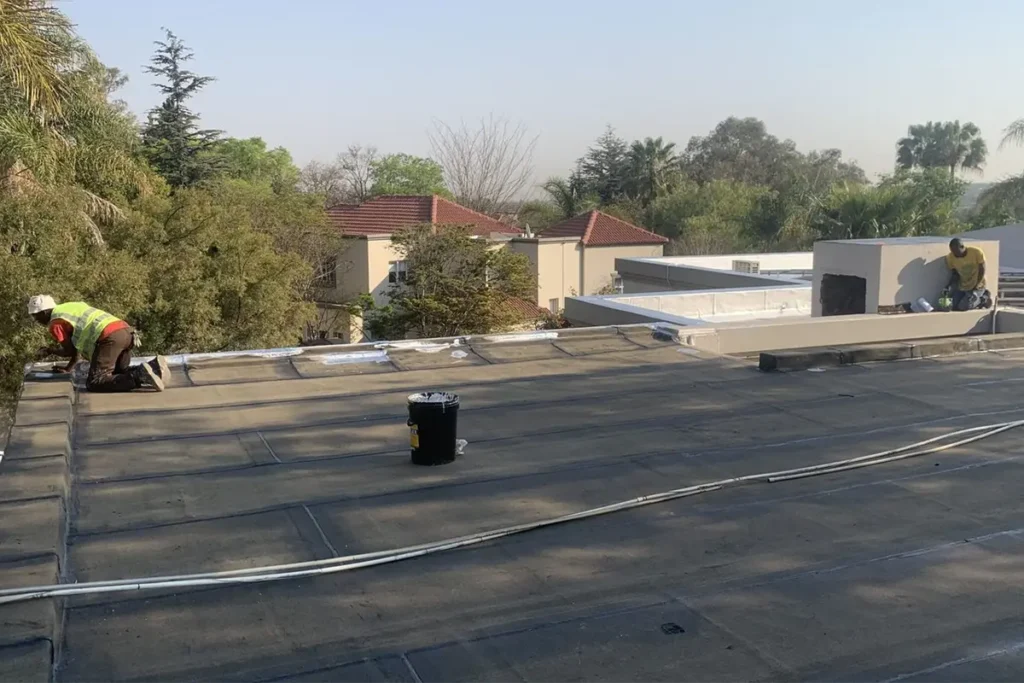 waterproofing-bryanston-membrane-application.webp Roof slab waterproofing Bryanston with torch-on membrane installation in progress