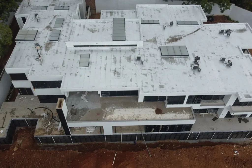Roof waterproofing Sandton full property before waterproofing showing flat roof waterproofing Sandton condition and surface wear