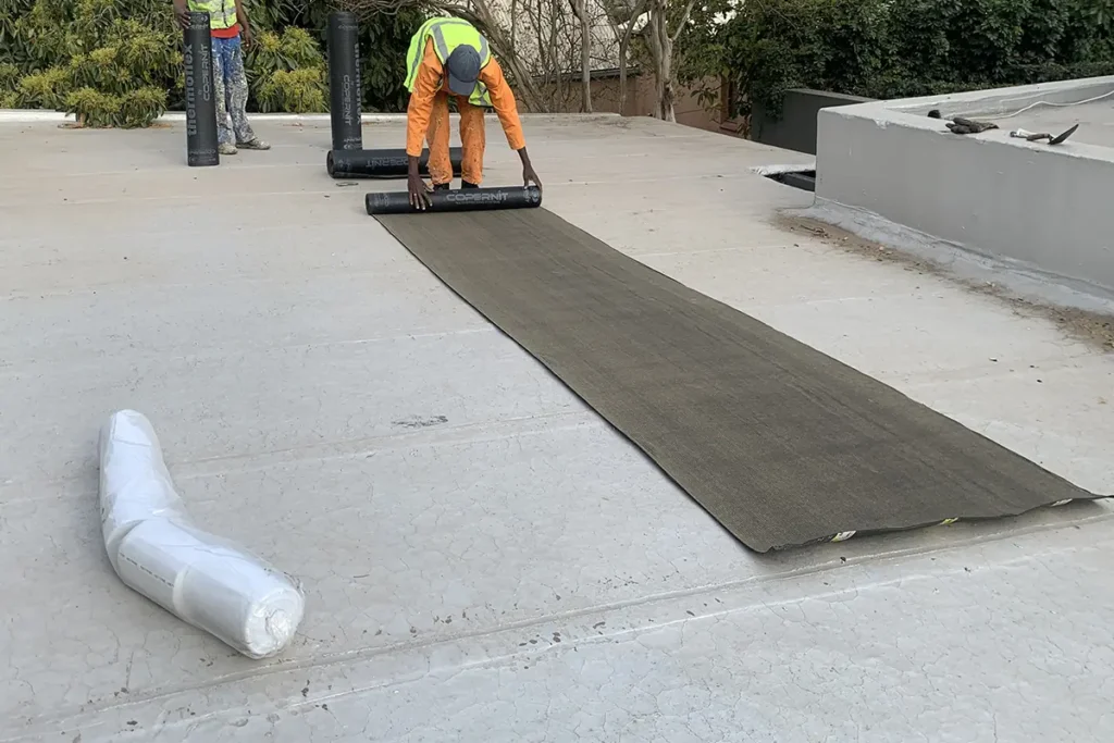 Rubber membrane rollout before Torch-on Roof Waterproofing Parktown North