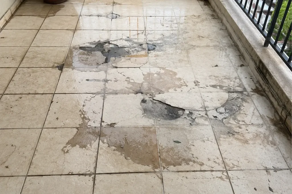 johannesburg-leaking-tiled-balcony.webp Balcony waterproofing Johannesburg problem showing leaking tiled balcony with failed grout and surface damage