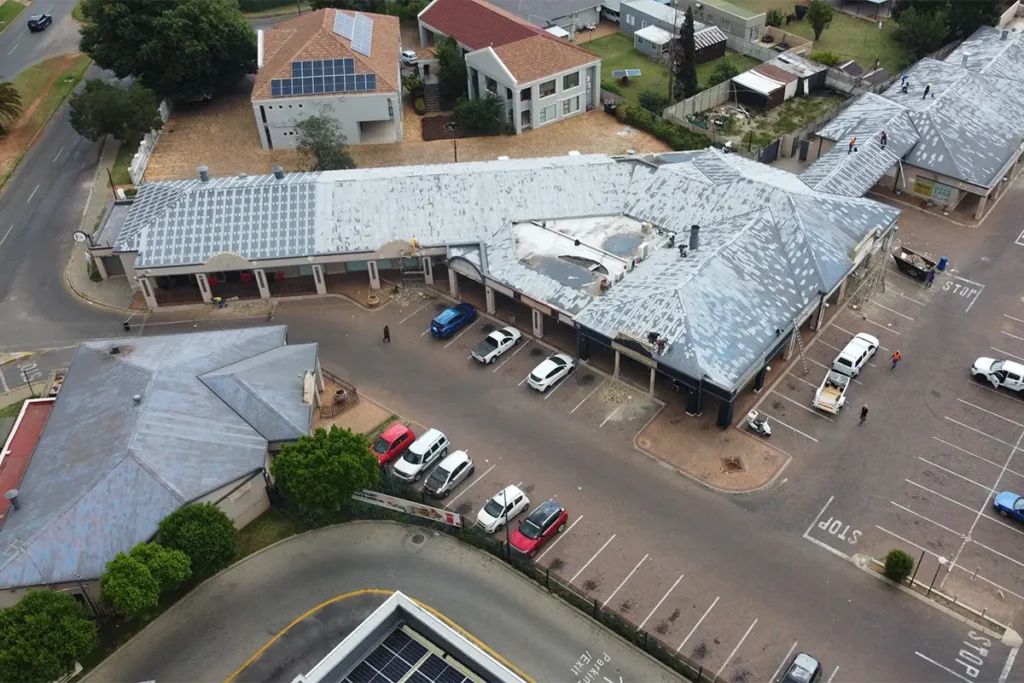 High aerial drone image of commercial roof waterproofing Roodepoort across the full retail property