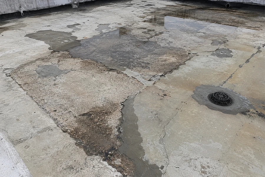 Damaged roof slab surface showing need for torch-on waterproofing Johannesburg