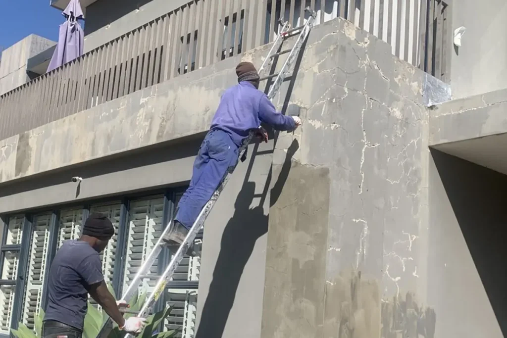 Wall waterproofing Westcliff worker applying exterior wall waterproofing.
