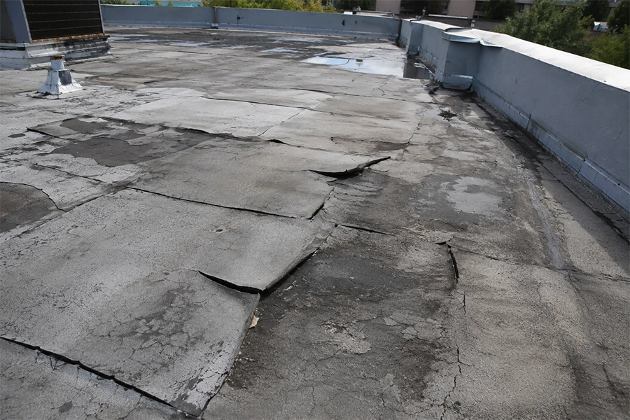 Failed flat roof membrane showing why torch-on waterproofing Johannesburg may be needed