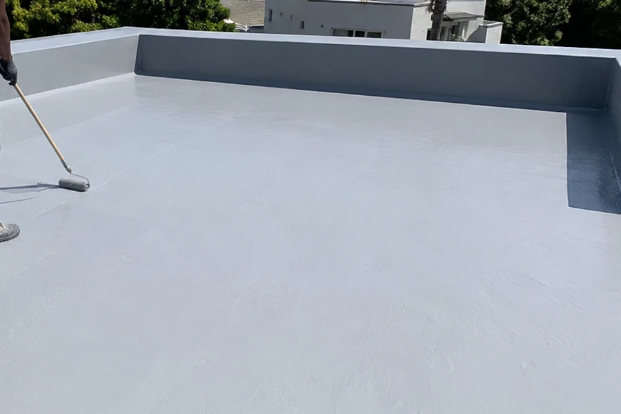 Liquid coating system applied to a flat roof for flat roof waterproofing Johannesburg, showing a smooth waterproof coating on a concrete roof surface.