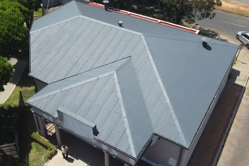 Drone image of separate building after metal roof waterproofing Roodepoort with final waterproof coating applied