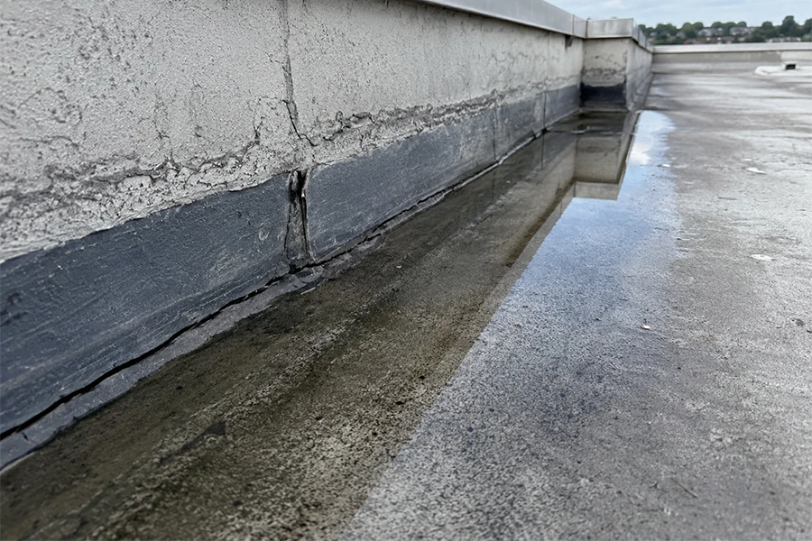 Parapet wall leak risk on flat roof needing torch-on waterproofing Johannesburg
