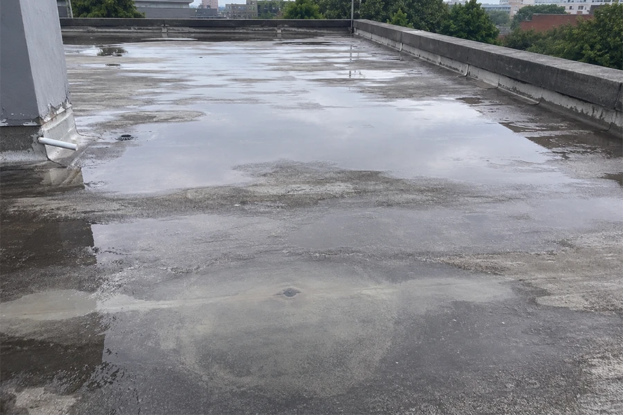 Ponding water on flat roof showing need for torch-on waterproofing Johannesburg