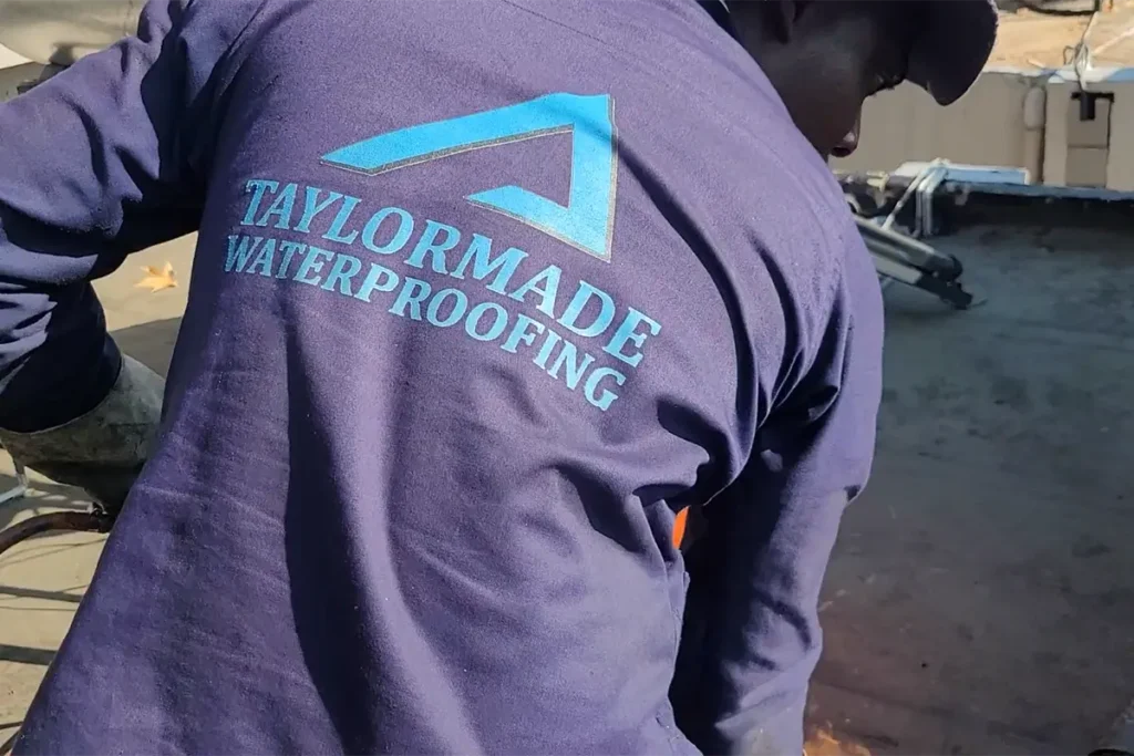 TaylorMade worker carrying out torch-on waterproofing Randburg on a flat roof section