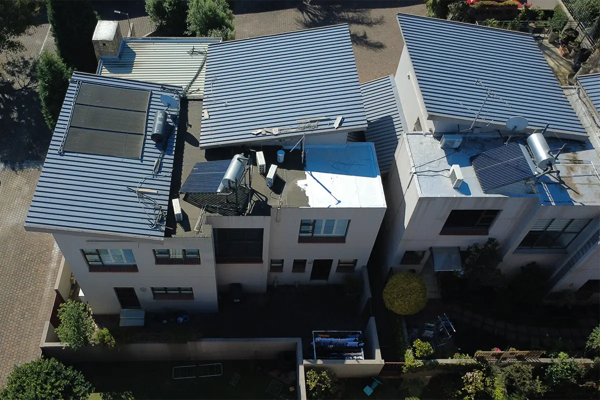 Torch-on waterproofing Randburg with membrane and UV protective coating being applied