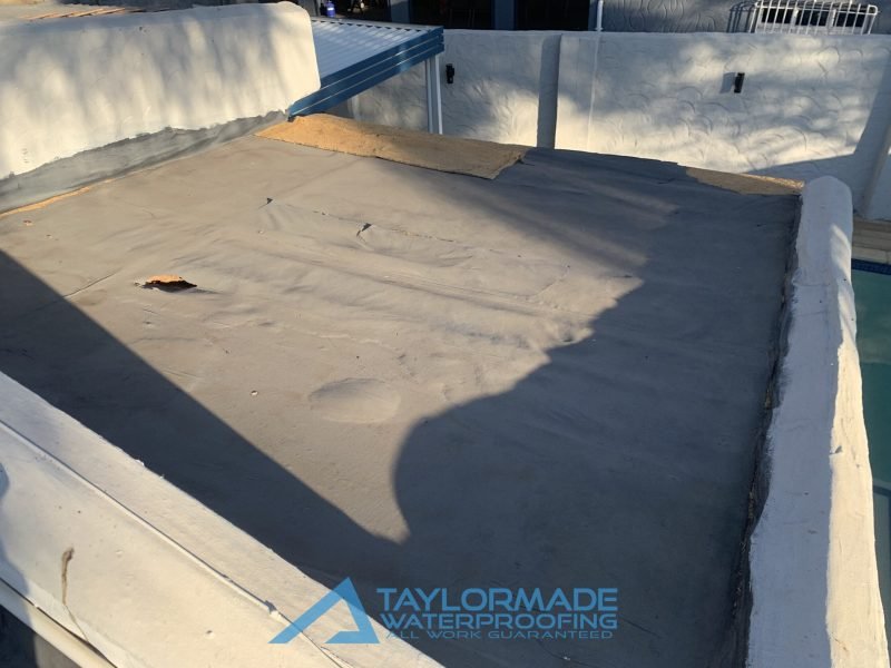 Flat roof with leaks and holes, before waterproofing is applied.