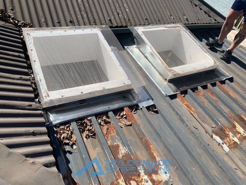 Neglected corrugated roof in Parkhurst with rust and wear, requiring flat roof waterproofing for restoration and protection.