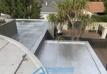 Completed flat roof in Parktown North with torch-on waterproofing and protective paint applied for a durable weatherproof finish.