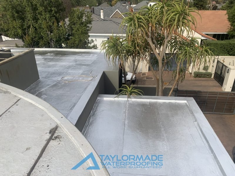 Completed flat roof in Parktown North with torch-on waterproofing and protective paint applied for a durable weatherproof finish.