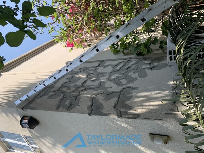 TM Waterproofing preparing a side wall of the Bryanston roof and wall project for repair and waterproofing.