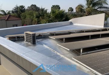 Completed protective painting on the Bryanston roof slab near solar panels for durability and weather resistance.
