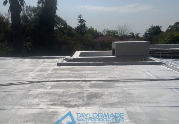 Completed Bryanston roof section with protective paint applied on the roof slab for durability and surface protection.