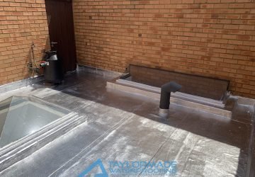 Flat Roof with torch-on membranes and painted in sliver applied, showing waterproofing protection.
