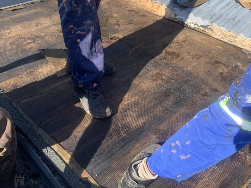 Old membranes removed on Parkhurst slab roof and skylight, ready for torch-on membranes application.