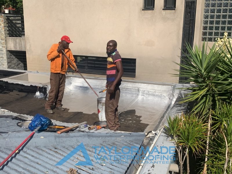 Flat roof waterproofing on a slab roof around a skylight in Parkhurst to prevent leaks and water damage.