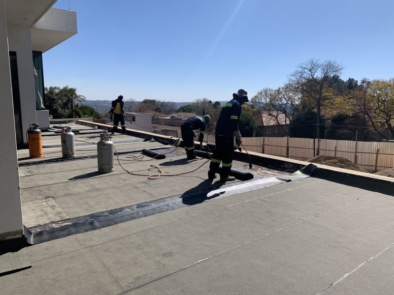 TM Waterproofing applying waterproofing membrane on the balcony of a luxury Sandton home.