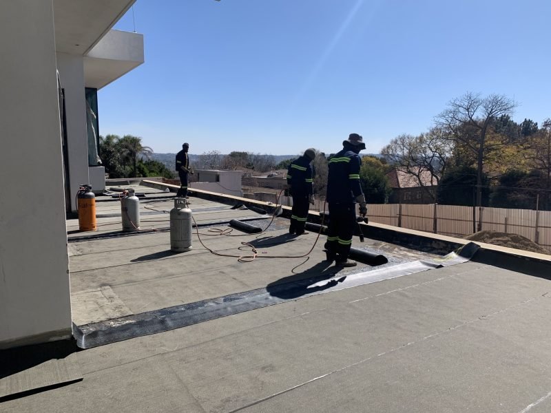 TM Waterproofing applying a waterproof membrane to the balcony slab of a luxury Sandton home.