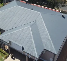 Drone image of separate building after metal roof waterproofing Roodepoort with final waterproof coating applied